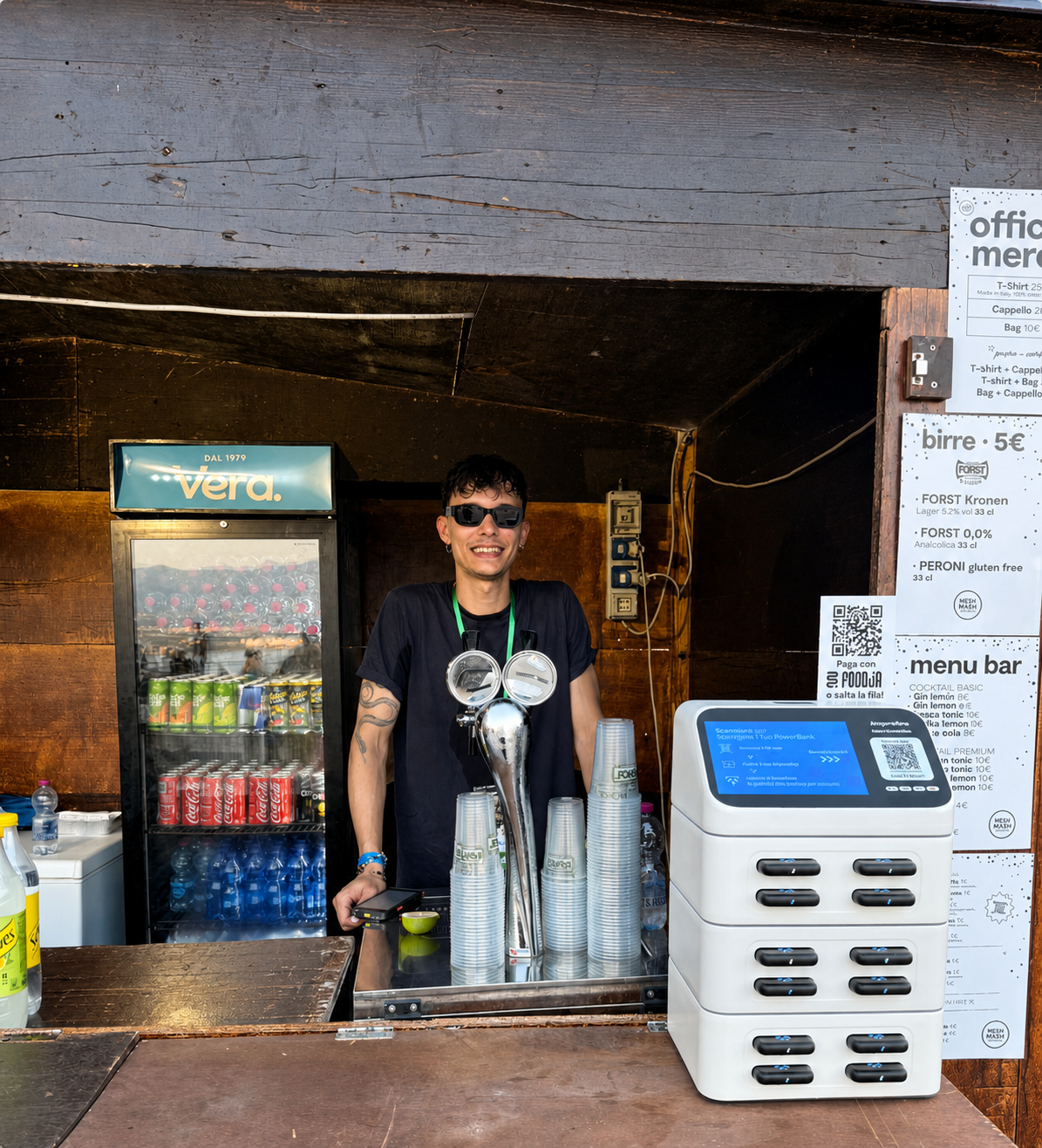 Hospitality operator standing beside a portable-charging station